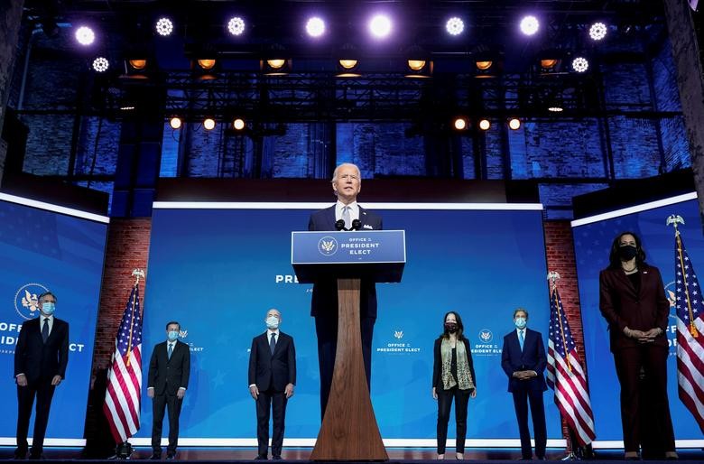 President-elect Joe Biden stands with his nominees for his national security team at his transition headquarters in the Queen Theater in Wilmington, Delaware, November 24. (L-R), are: Antony Blinken to be secretary of state; Jake Sullivan to be U.S. national security adviser; Alejandro Mayorkas to be secretary of Homeland Security; Avril Haines to be director of national intelligence; John Kerry to be a special envoy for climate change; and Ambassador to the United Nations-nominee Linda Thomas-Greenfield, who stands behind Vice President-elect Kamala Haris. REUTERS/Joshua Roberts